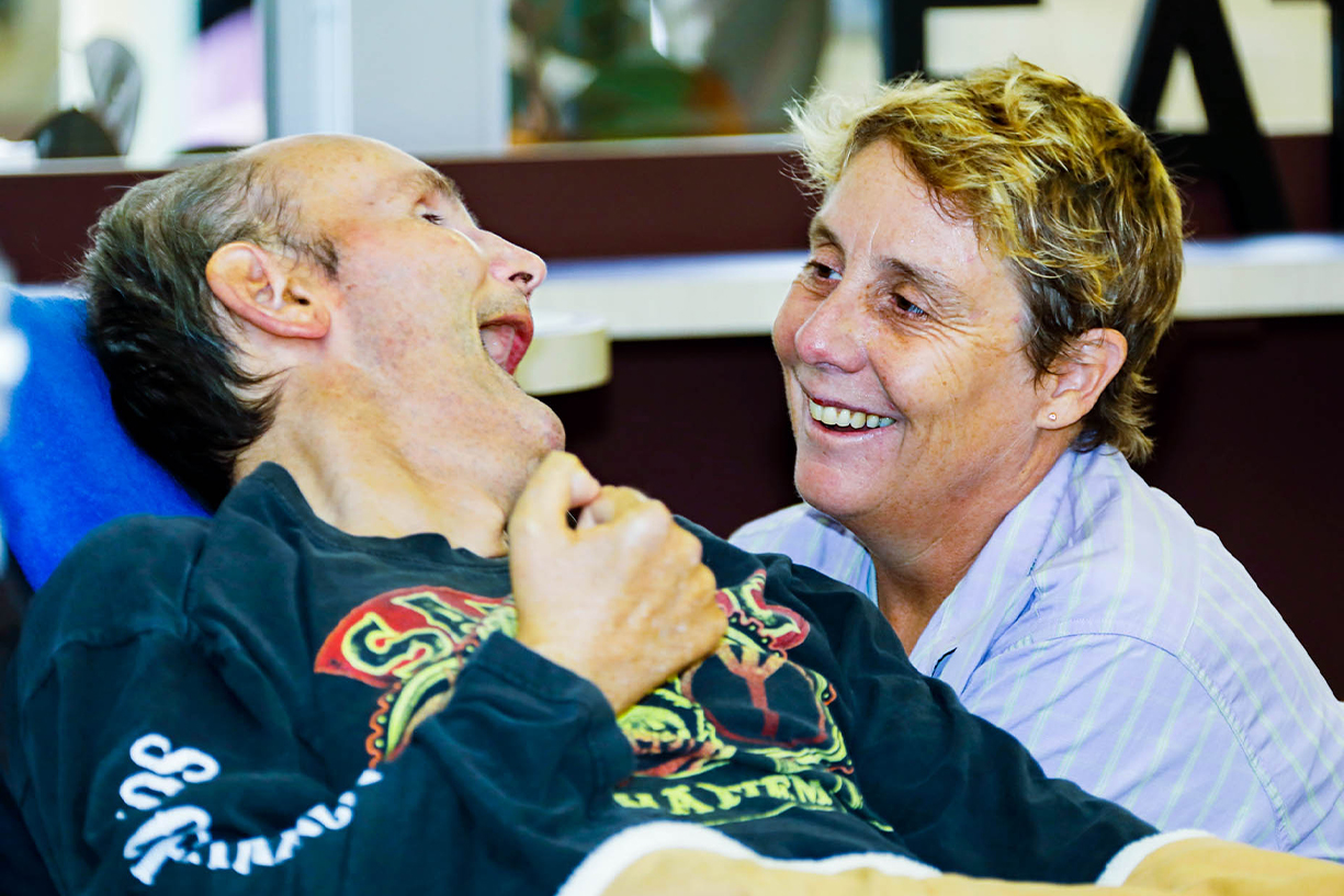about shift homes - sda approved homes A customer and friend enjoing a laugh together
