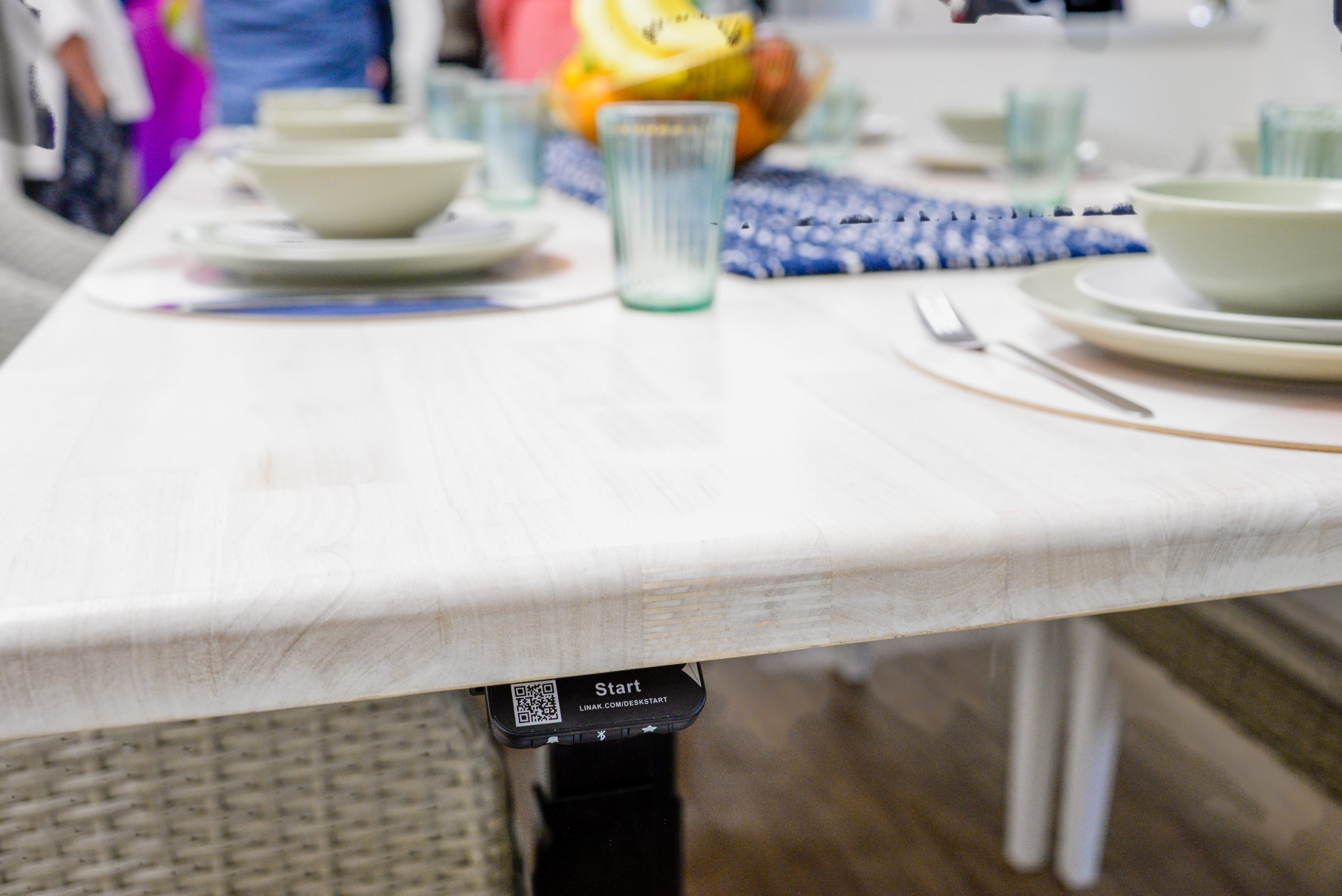 Height adjustable table showing controls